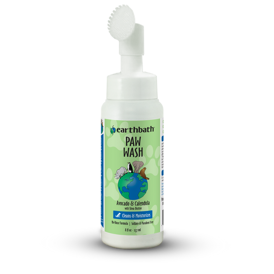 Bottle of Earthbath Paw Wash with a brush on a white background
